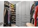 This walk-in closet is well-organized with custom shelves and storage cabinets at 550 Tidewater Chase Ln, Summerville, SC 29486