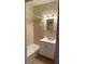 Bathroom featuring a bathtub, vanity, sink and large mirror with lighting at 56 Laurens St, Charleston, SC 29401
