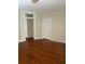 Bedroom with hardwood floors, chandelier, and neutral wall color at 56 Laurens St, Charleston, SC 29401