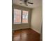 Bedroom with natural light, ceiling fan, and hardwood flooring at 56 Laurens St, Charleston, SC 29401