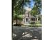 Charming two-story brick home with inviting porch and manicured landscaping at 56 Laurens St, Charleston, SC 29401