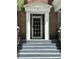 Close-up of the home's front door and entryway with stairs leading to the entrance at 56 Laurens St, Charleston, SC 29401