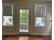 Bright living room with hardwood floors, large windows, and a rear entrance at 56 Laurens St, Charleston, SC 29401