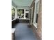 Exterior view from the porch with brick walls, columns, and outdoor features at 56 Laurens St, Charleston, SC 29401