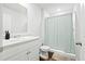 Clean bathroom features white cabinets, modern fixtures, and shower with curtain at 604 Red Mulberry Rd, Moncks Corner, SC 29461