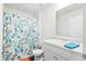 Bright bathroom featuring a vanity with plenty of counter space and a colorful shower curtain at 604 Red Mulberry Rd, Moncks Corner, SC 29461