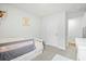 Bright bedroom features a white toddler bed, plenty of natural light, and wood floors at 604 Red Mulberry Rd, Moncks Corner, SC 29461