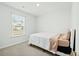 Neutrally decorated bedroom with window bringing in natural light at 604 Red Mulberry Rd, Moncks Corner, SC 29461