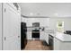 Modern kitchen with stainless steel appliances, white cabinets, and wood flooring at 604 Red Mulberry Rd, Moncks Corner, SC 29461
