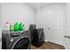 Laundry room with sleek washer and dryer, and a door for easy access at 604 Red Mulberry Rd, Moncks Corner, SC 29461