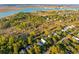 Beautiful aerial view of homes nestled among trees near a body of water at 608 W Beach Ct, Folly Beach, SC 29439