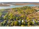 Scenic aerial view of homes surrounded by lush trees near a tranquil river at 608 W Beach Ct, Folly Beach, SC 29439