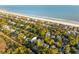Aerial view of homes lining the shoreline at 608 W Beach Ct, Folly Beach, SC 29439