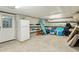 Unfinished basement with storage, recreational items, and access door at 608 W Beach Ct, Folly Beach, SC 29439