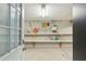 Unfinished basement with shelving, storage, and a door at 608 W Beach Ct, Folly Beach, SC 29439