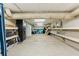 Unfinished basement space with built-in shelving and ample storage options at 608 W Beach Ct, Folly Beach, SC 29439