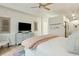 Comfortable bedroom with a TV, dresser, and stylish decor at 608 W Beach Ct, Folly Beach, SC 29439