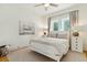Cozy bedroom featuring a neutral color palette, two windows, and classic bedside lamps at 608 W Beach Ct, Folly Beach, SC 29439