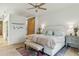 A bright and airy bedroom with a sliding barn door, plush bedding and natural light at 608 W Beach Ct, Folly Beach, SC 29439