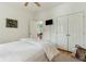 Bright bedroom with a view to another room and double closets, offering ample storage at 608 W Beach Ct, Folly Beach, SC 29439