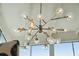 Statement chandelier with exposed bulbs hanging from the ceiling at 608 W Beach Ct, Folly Beach, SC 29439