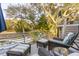 Spacious deck overlooking lush landscaping, complete with cozy seating for outdoor enjoyment at 608 W Beach Ct, Folly Beach, SC 29439