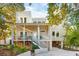 Beautiful house with two stories and a cozy front porch at 608 W Beach Ct, Folly Beach, SC 29439