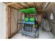 Garage with a charming green golf cart inside at 608 W Beach Ct, Folly Beach, SC 29439