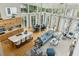 Open-concept living space featuring a kitchen island, dining area, and a comfortable seating area at 608 W Beach Ct, Folly Beach, SC 29439