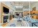 Large, open living area with fireplace, comfortable seating, and great natural light at 608 W Beach Ct, Folly Beach, SC 29439