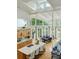 Open-concept living space featuring a kitchen island, dining area, and a comfortable seating area at 608 W Beach Ct, Folly Beach, SC 29439