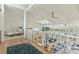 Open loft with a railing overlooking the living room with views from the many windows at 608 W Beach Ct, Folly Beach, SC 29439