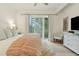 Spacious main bedroom with white walls and ensuite bathroom at 608 W Beach Ct, Folly Beach, SC 29439