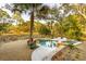 Beautiful outdoor pool area featuring a stone patio, jacuzzi and lush landscaping at 608 W Beach Ct, Folly Beach, SC 29439