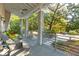 Relaxing covered porch with comfortable seating, offering a serene outdoor living space at 608 W Beach Ct, Folly Beach, SC 29439
