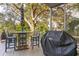 Enjoy outdoor dining with a grill on this screened porch at 608 W Beach Ct, Folly Beach, SC 29439