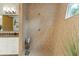 Walk-in shower is lined with neutral tile and features a window, bench, and modern showerhead at 608 W Beach Ct, Folly Beach, SC 29439