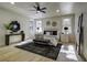 Spacious bedroom with ceiling fan, a large bed, wood floors and natural light at 6094 Chisolm Rd, Johns Island, SC 29455