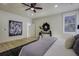 Spacious bedroom with ceiling fan, a large bed, wood floors and natural light at 6094 Chisolm Rd, Johns Island, SC 29455