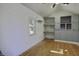 Bright bonus room with wood floors, a built-in workspace, and a vaulted ceiling at 6094 Chisolm Rd, Johns Island, SC 29455