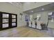 Dining room with wood floors, large windows, view of the backyard, and modern decor at 6094 Chisolm Rd, Johns Island, SC 29455