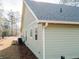 Side view of the house with green siding and views of the roof at 64 Piedmont Rd, Walterboro, SC 29488