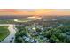 Breathtaking aerial view of a charming neighborhood nestled along a winding river at sunset at 6917 Tanner Hall Blvd, Hanahan, SC 29410