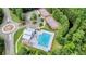 Aerial view of community pool, clubhouse, tennis courts, and parking area at 6917 Tanner Hall Blvd, Hanahan, SC 29410
