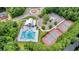 Aerial view of community pool, clubhouse, tennis courts, and parking area at 6917 Tanner Hall Blvd, Hanahan, SC 29410