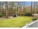 View of backyard from deck; golf net, beautiful trees, and privacy fence at 6917 Tanner Hall Blvd, Hanahan, SC 29410