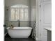 Elegant bathroom featuring a soaking tub, marble accents, and modern fixtures at 6917 Tanner Hall Blvd, Hanahan, SC 29410