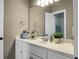 Bathroom with a large mirror, white cabinetry, and neutral wall color at 6917 Tanner Hall Blvd, Hanahan, SC 29410