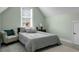 Bedroom featuring a bed with plush pillows, a chair, and a window at 6917 Tanner Hall Blvd, Hanahan, SC 29410