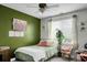 Cozy bedroom featuring a green accent wall, a daybed, and ample natural light at 6917 Tanner Hall Blvd, Hanahan, SC 29410